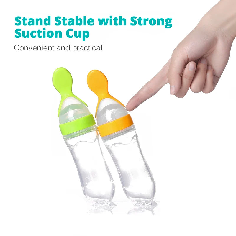 Two baby feeding bottles with green and orange caps on a white background, with text about strong suction cups.