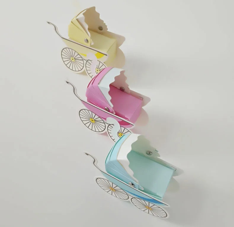 Three colorful baby carriages on a white background