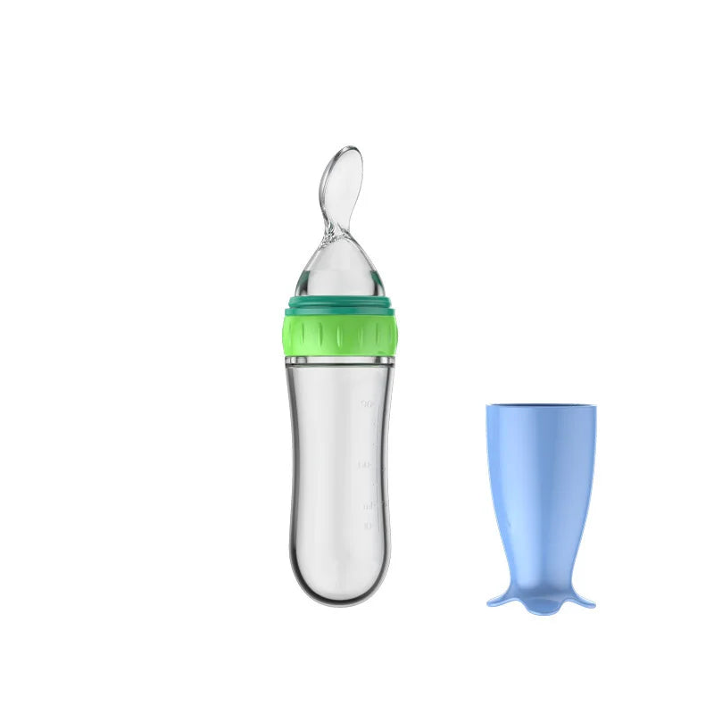 Baby feeding bottle with green cap and blue silicone cover on a white background