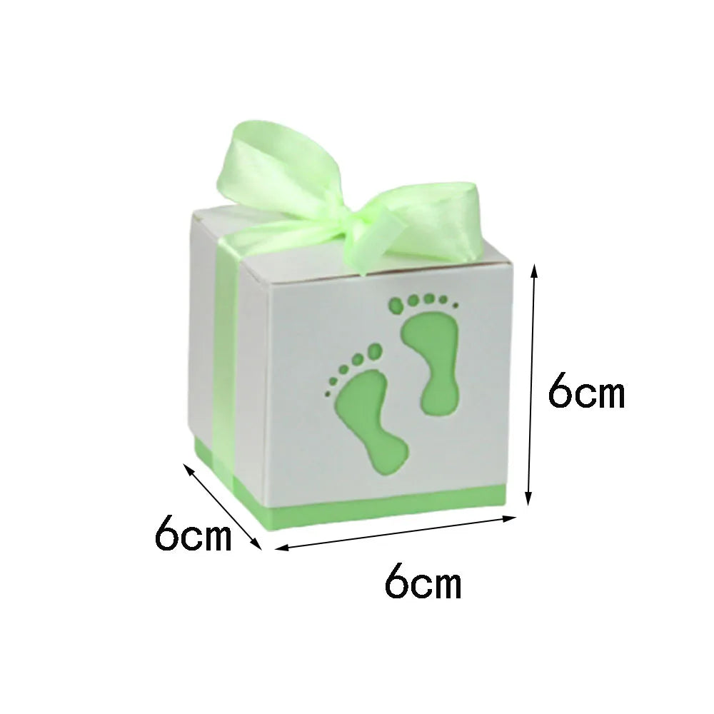 White box with green ribbon and footprints, labeled '6cm' on a white background