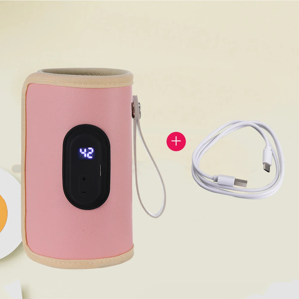 Pink electronic device with digital display and USB cable on a beige background