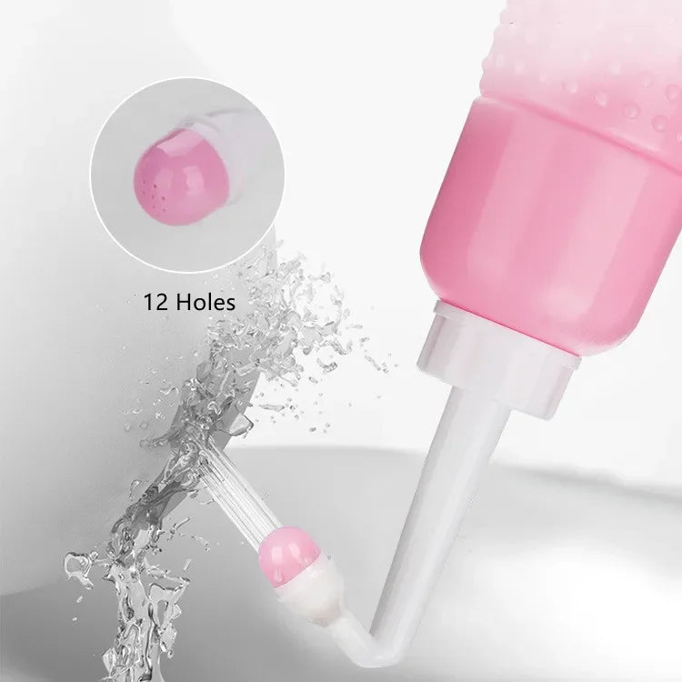 Pink and white cleaning tool with water splashing around it on a light gray background