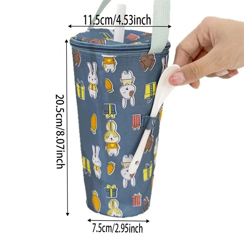 Blue cartoon-patterned cup holder with measurements and a hand holding a straw.