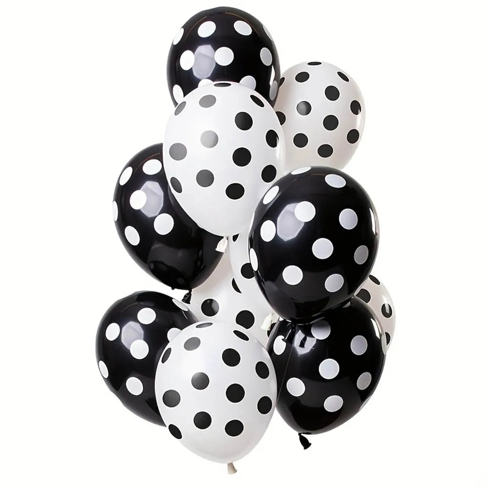 Bunch of black and white polka dot balloons on a white background