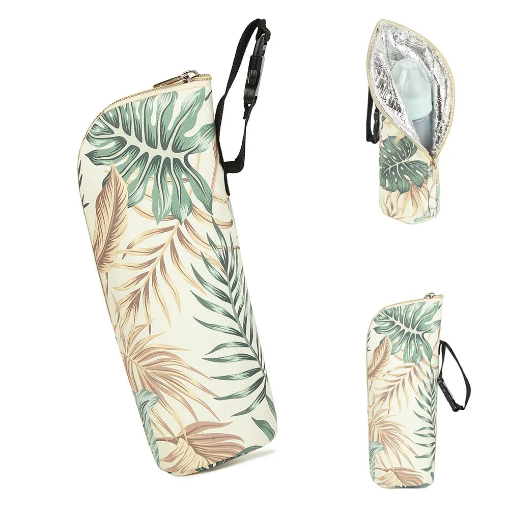 Tropical leaf-patterned umbrella and bag set on a white background