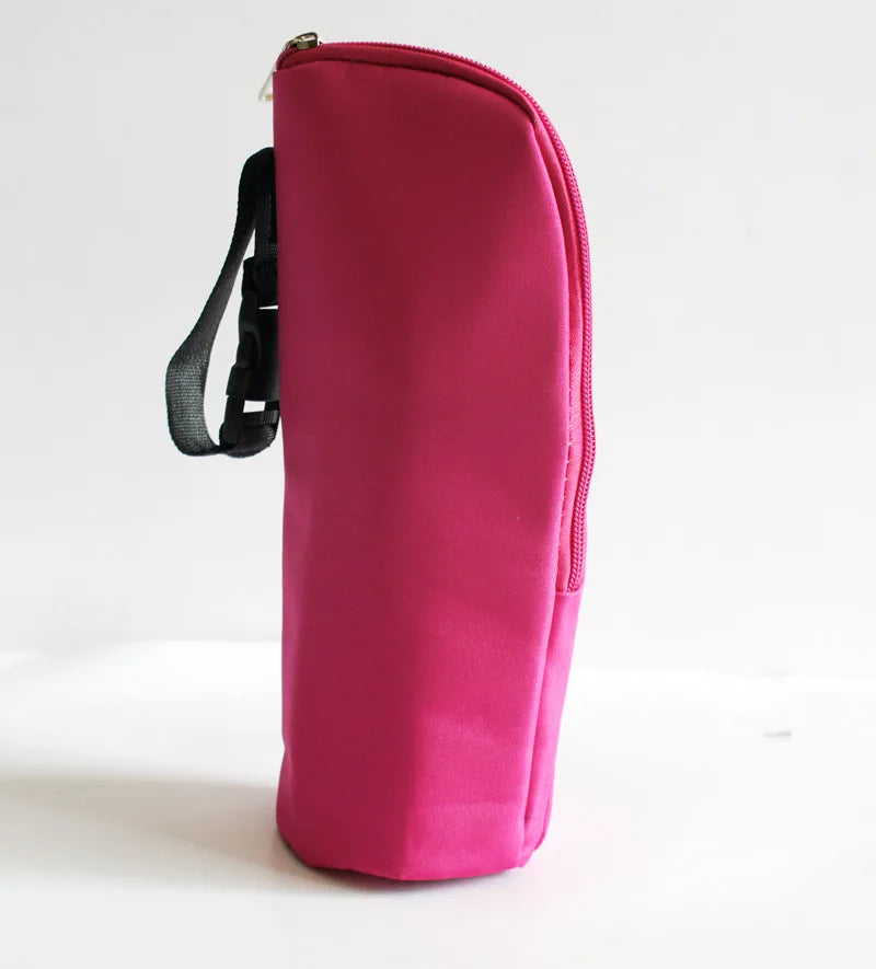 Pink bag with a black strap on a white background