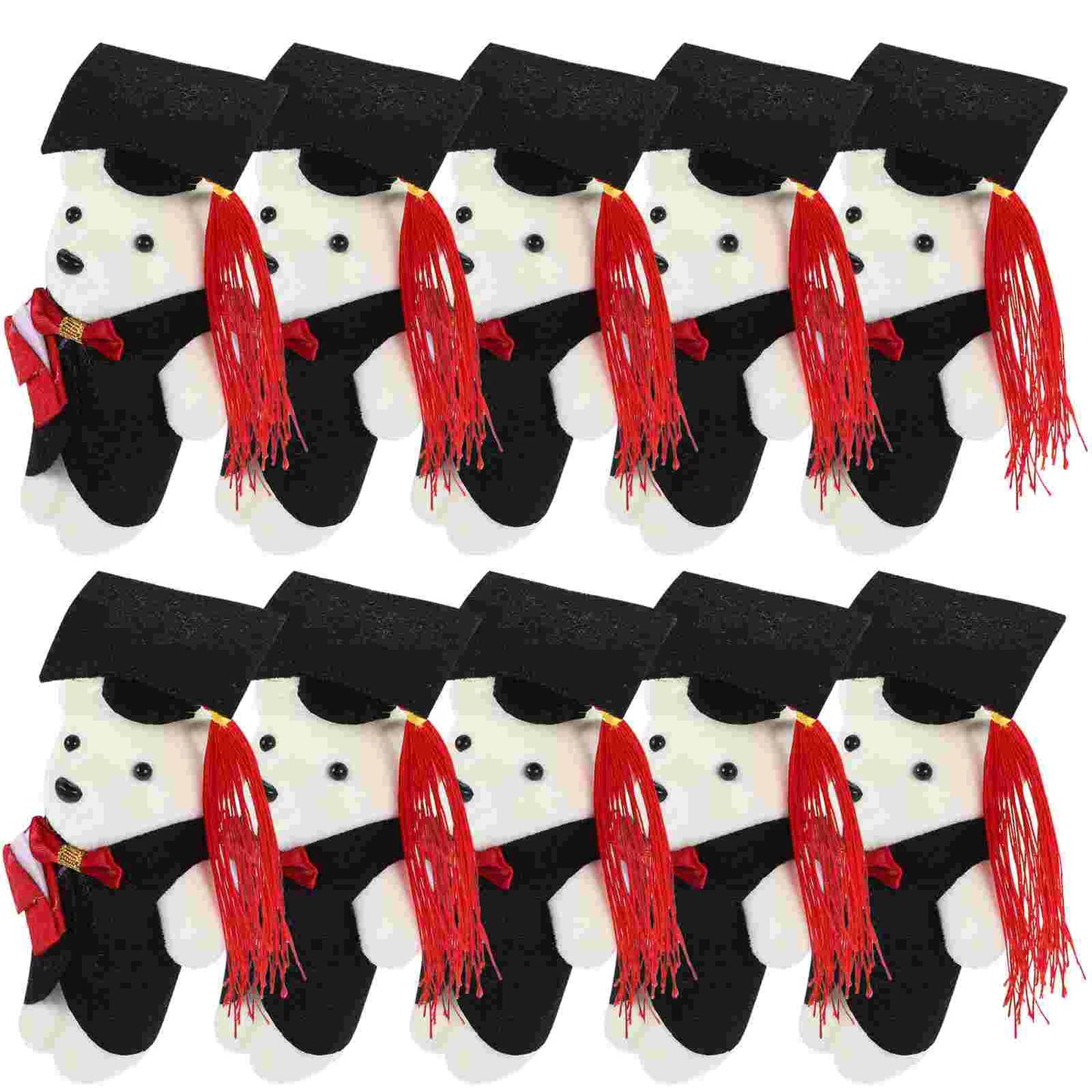 Set of white dog figurines wearing black graduation caps and gowns with red tassels.