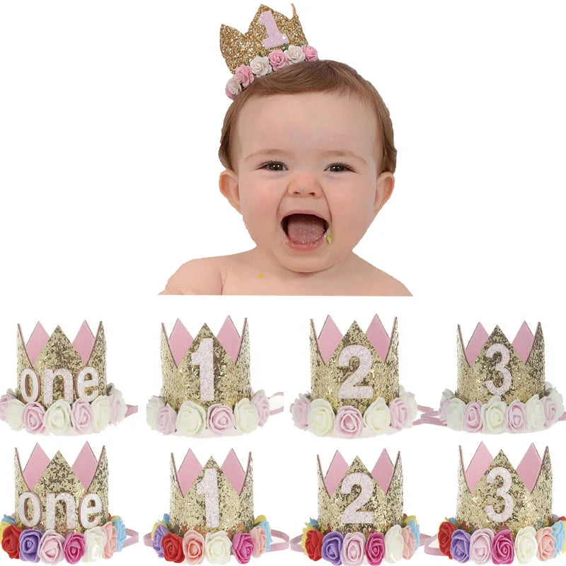 Baby wearing a decorative birthday crown with numbers and flowers, surrounded by similar crowns.