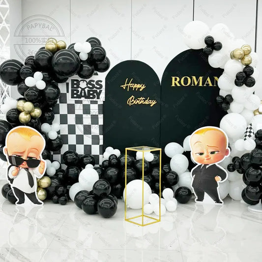 Birthday party setup with balloons, decorations, and 'Boss Baby' theme.