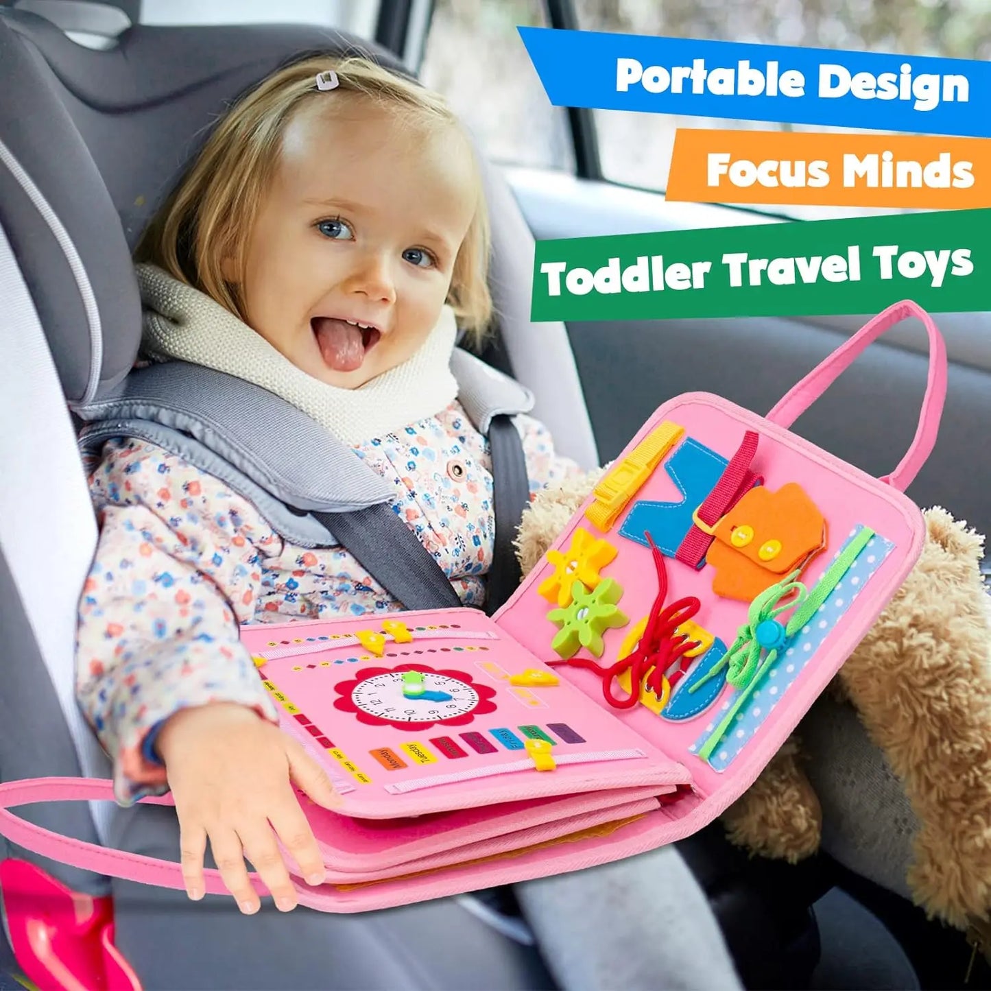 Child in a car seat holding a pink travel toy book with colorful toys.