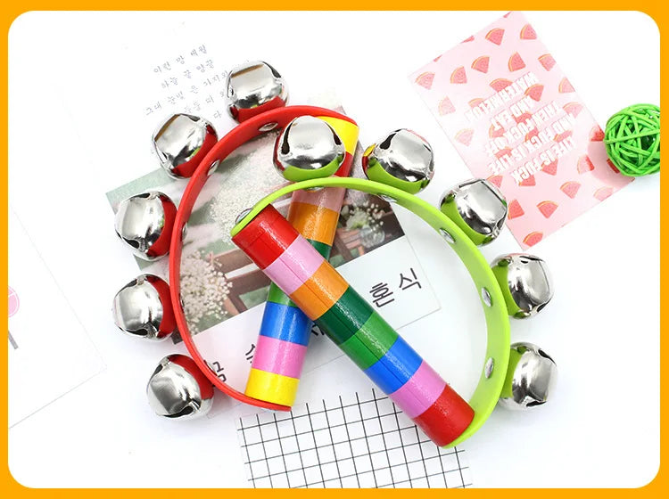 Colorful children's toy with metal bells on a white background
