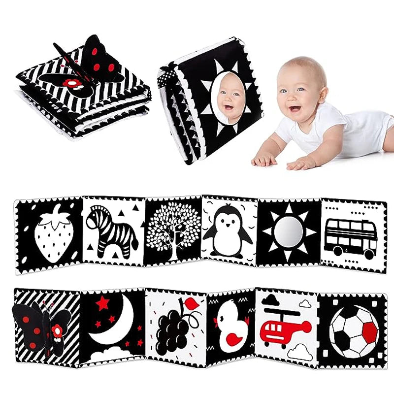 Baby play mat with black and white designs and a baby lying on a white surface.