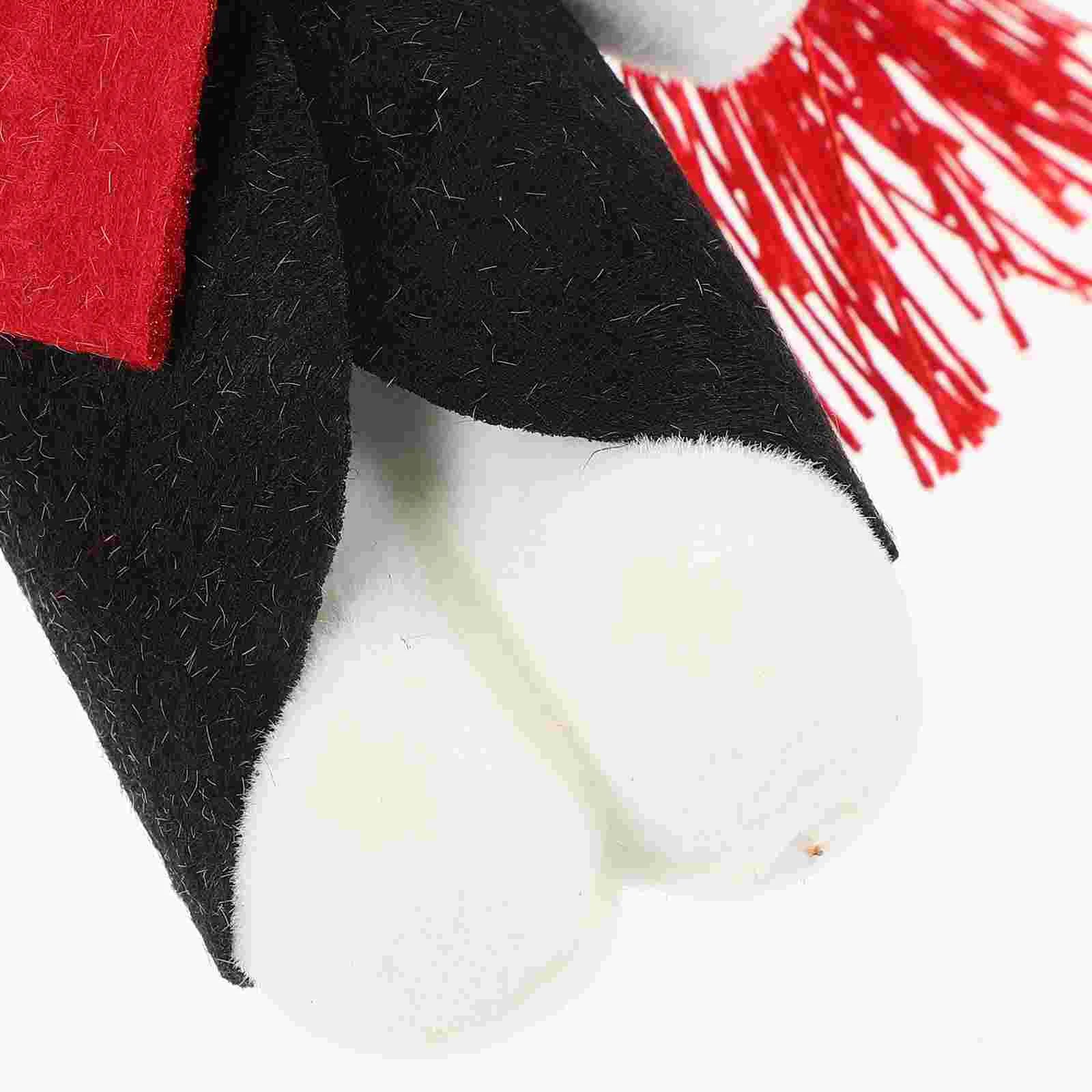 Close-up of a plush toy with red, black, and white colors on a white background