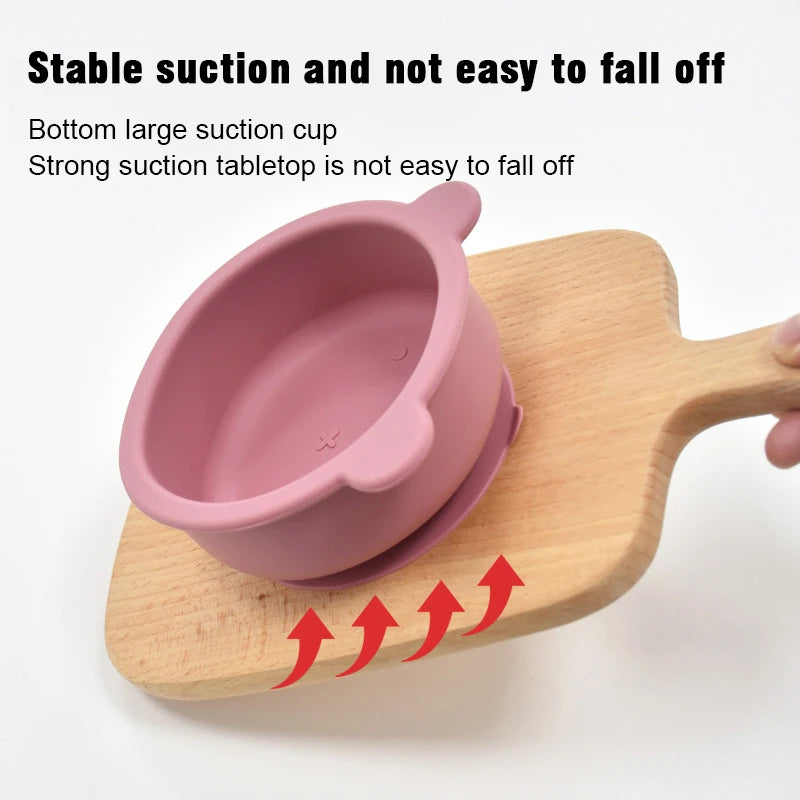 Pink suction cup on a wooden board with text highlighting stability