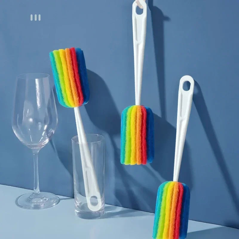 Colorful sponge cleaning brush with long handle for baby bottles and cups, by Nestacular.