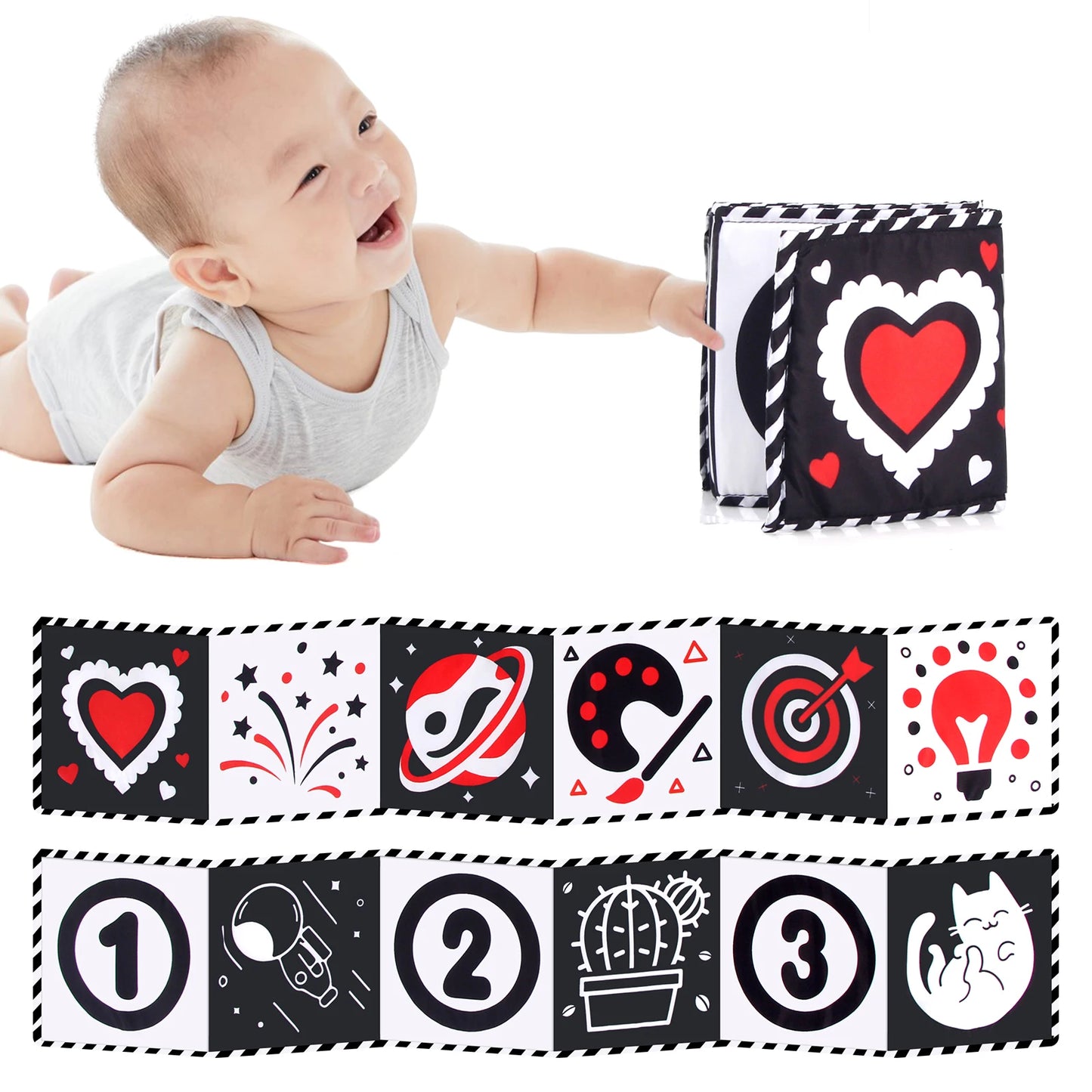 Baby playing with a soft book featuring black, white, and red patterns.