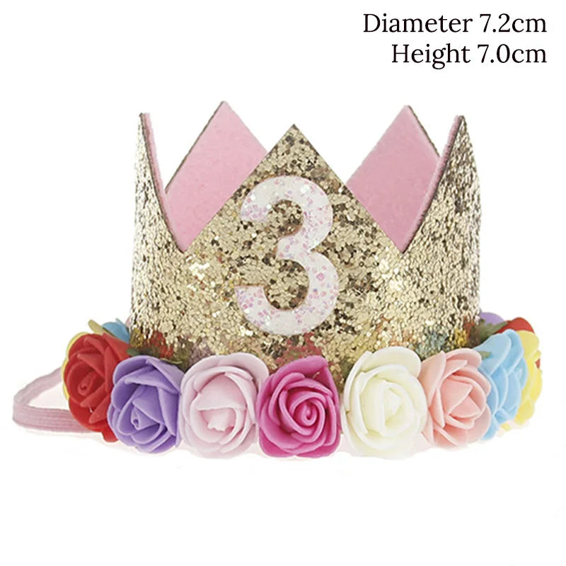 Gold glitter crown with number 3, pink interior, and floral decorations on a white background