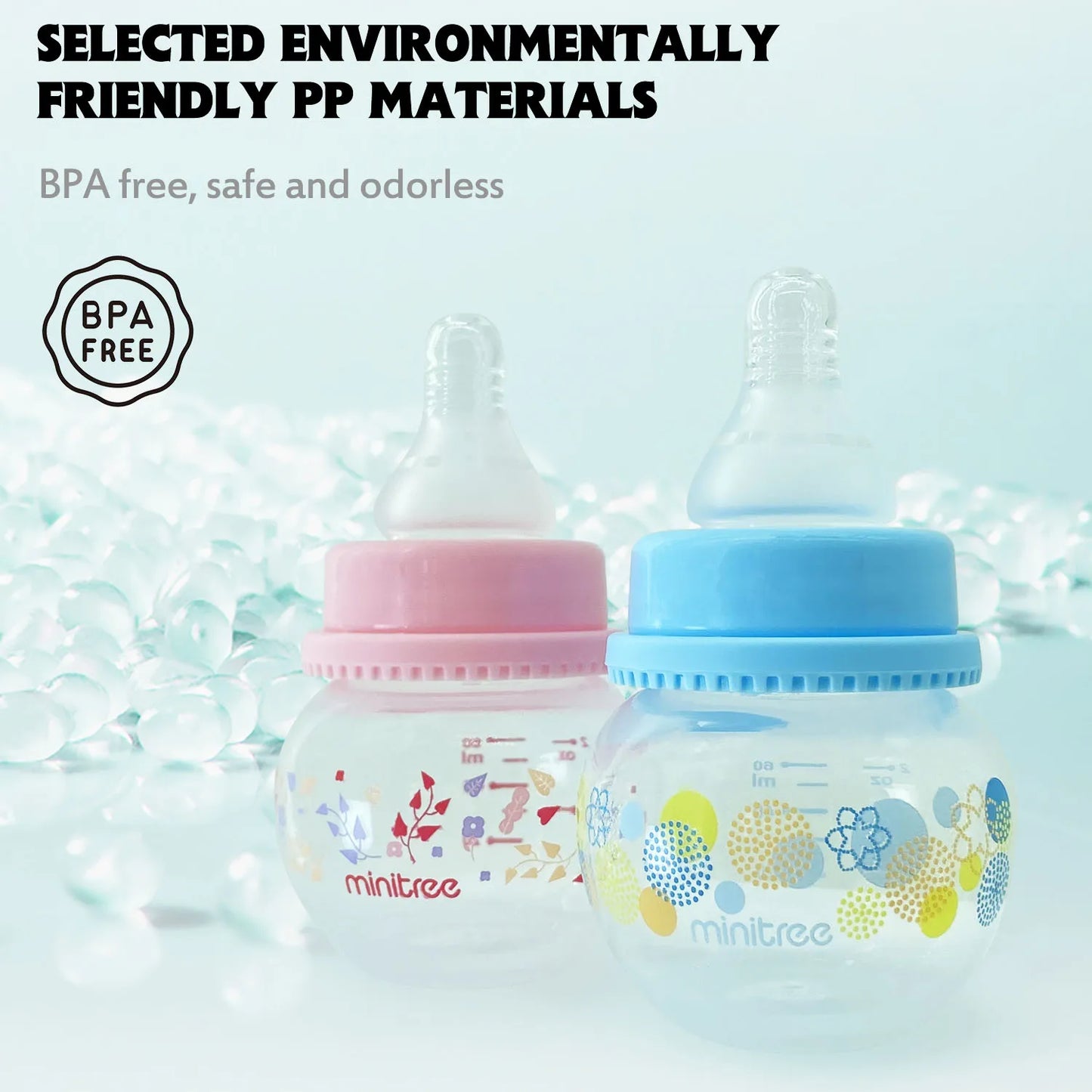 Two baby bottles with floral designs on a light blue background, featuring the brand 'minitree'.