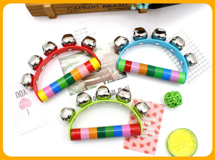 Colorful jingle bell toys with a small ball on a white background