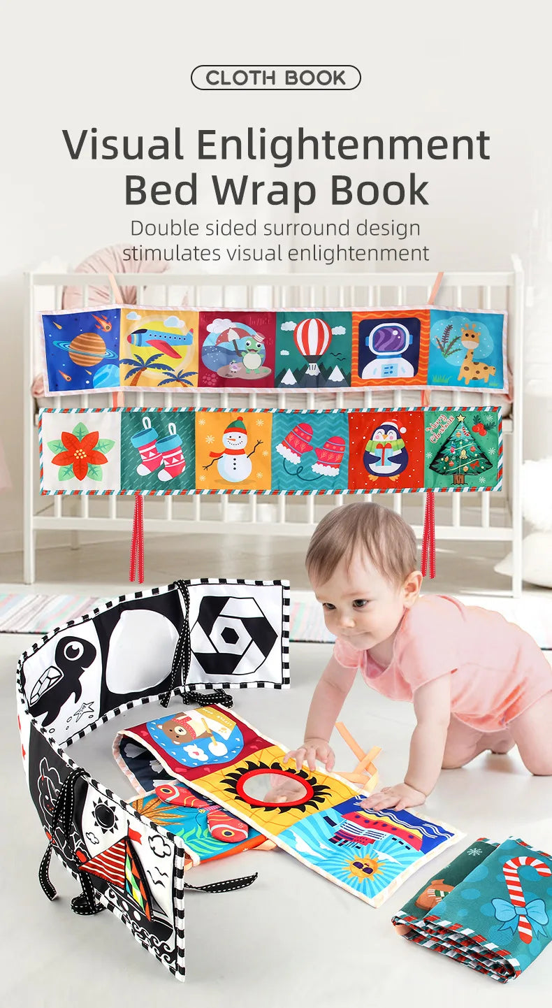 Baby playing with a colorful book and bed wrap on a crib