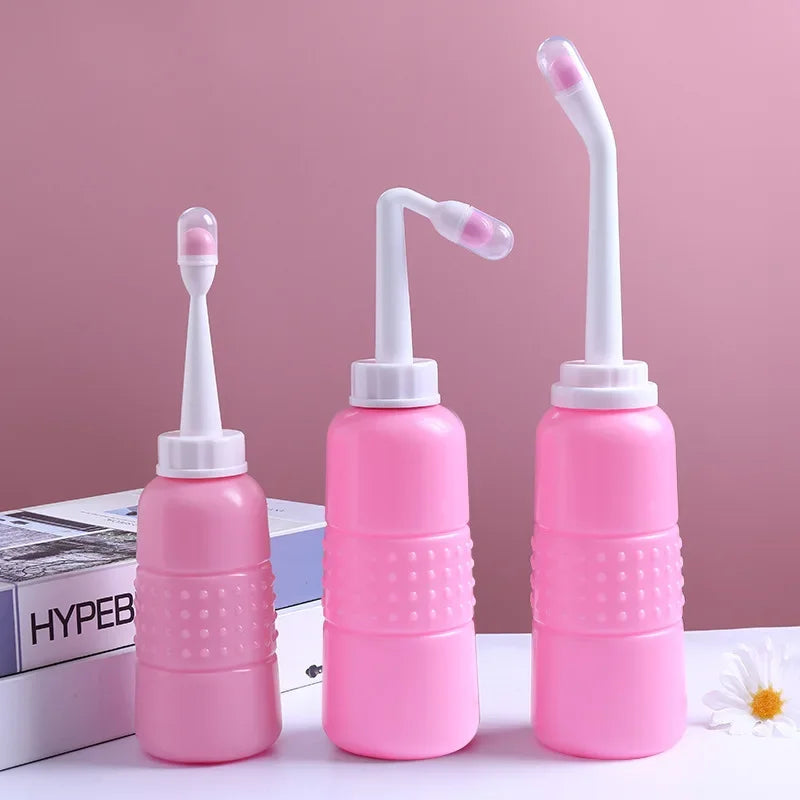 Three pink nasal irrigation devices on a white surface with a pink background.