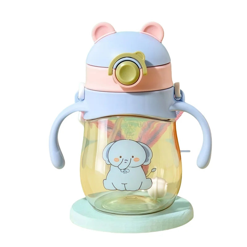 Children's sippy cup with cartoon elephant design on a white background
