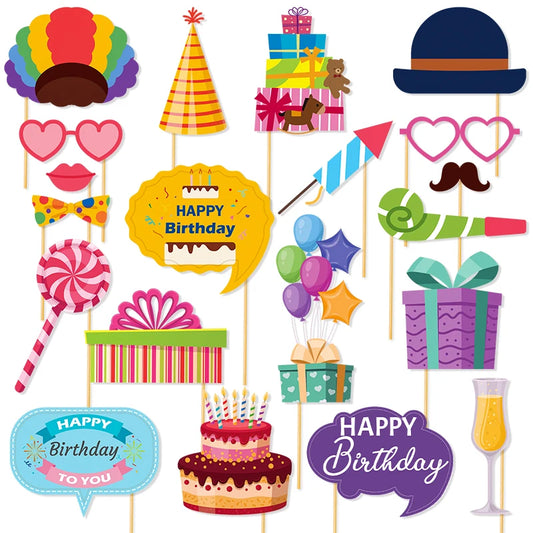 Collection of colorful birthday-themed photo booth props on sticks against a white background.