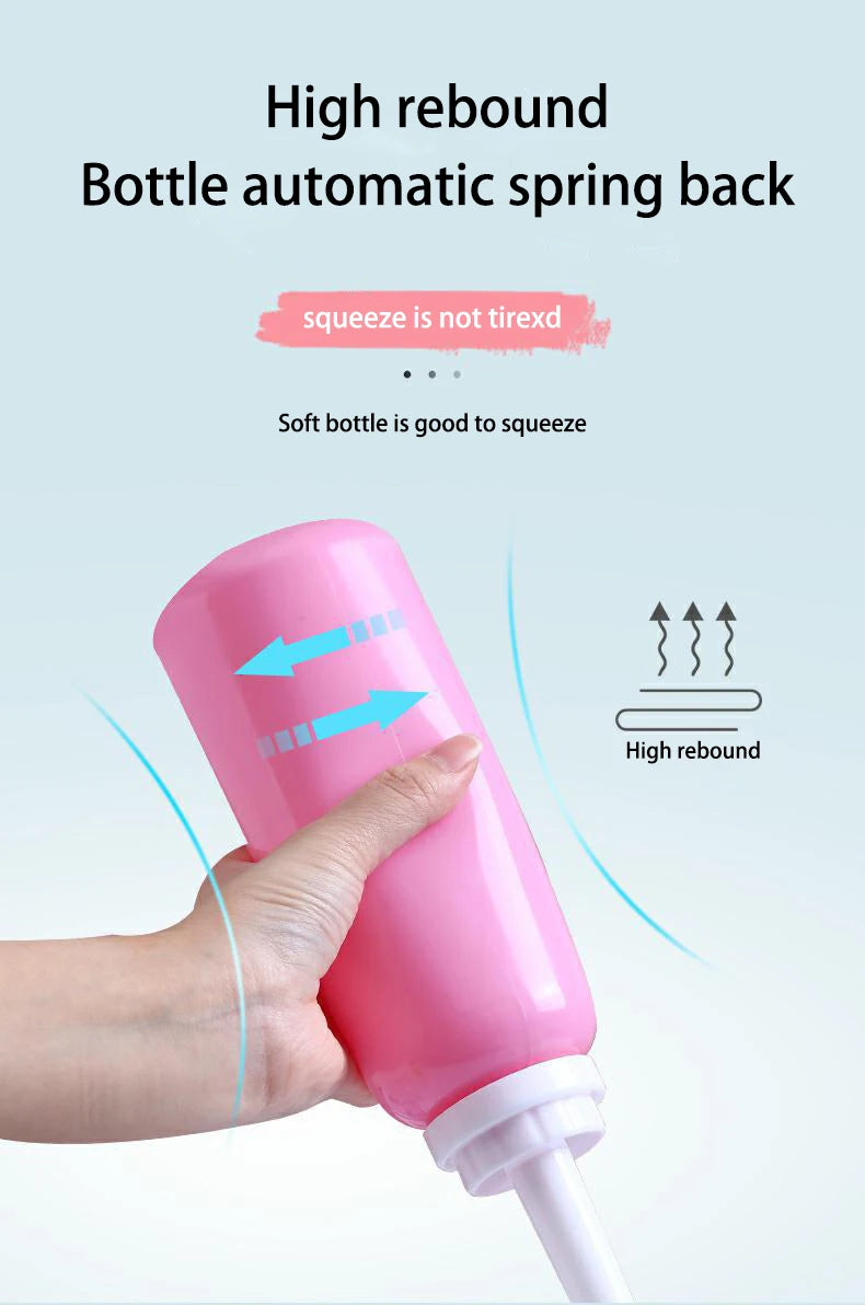 Pink bottle with high rebound feature being squeezed, on a light blue background.