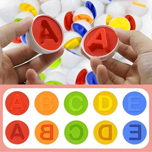 Colorful letter stamps held by hands with a stamp pad and letter stamps below.
