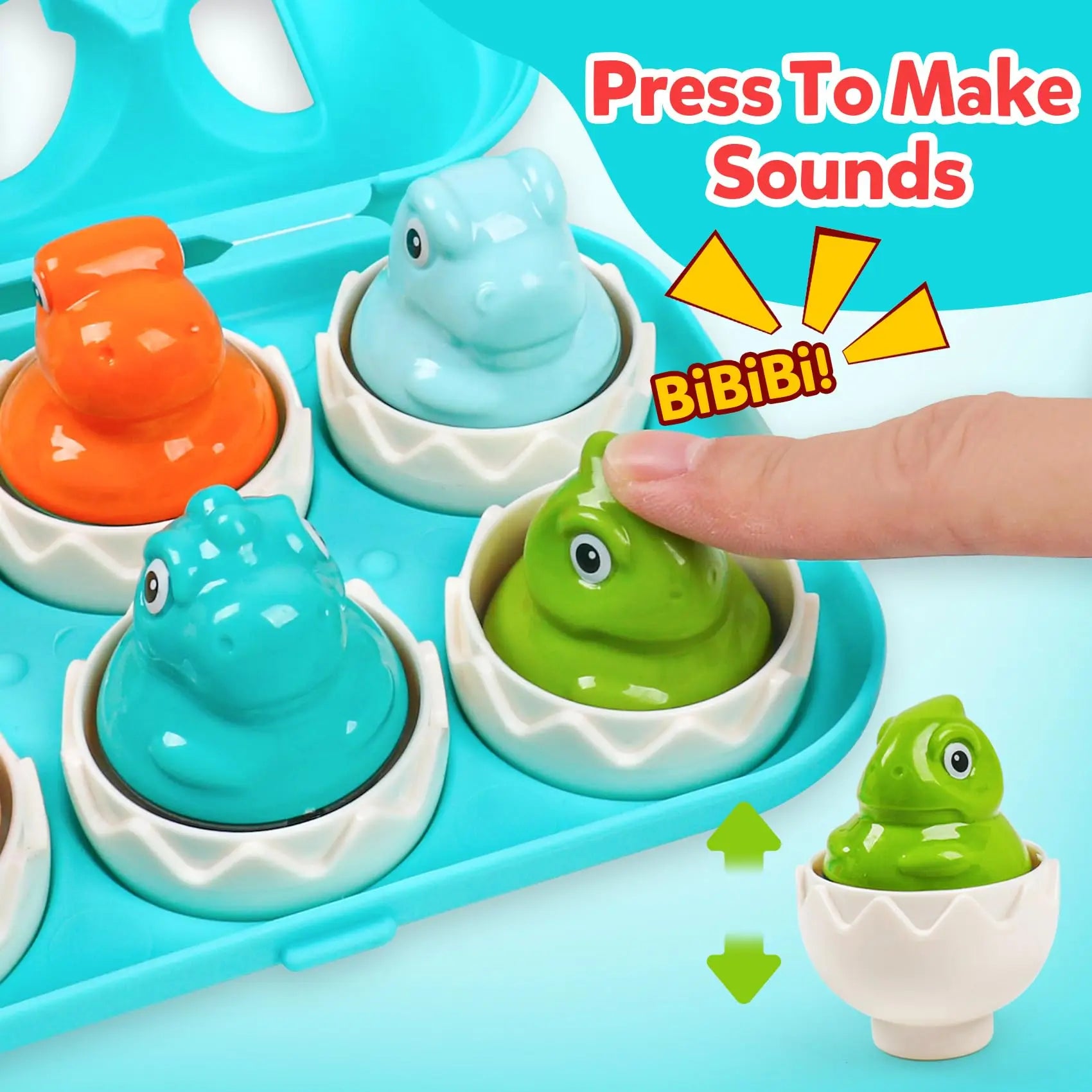 Toy with hatching dinosaur eggs that make sounds when pressed, on a blue tray.