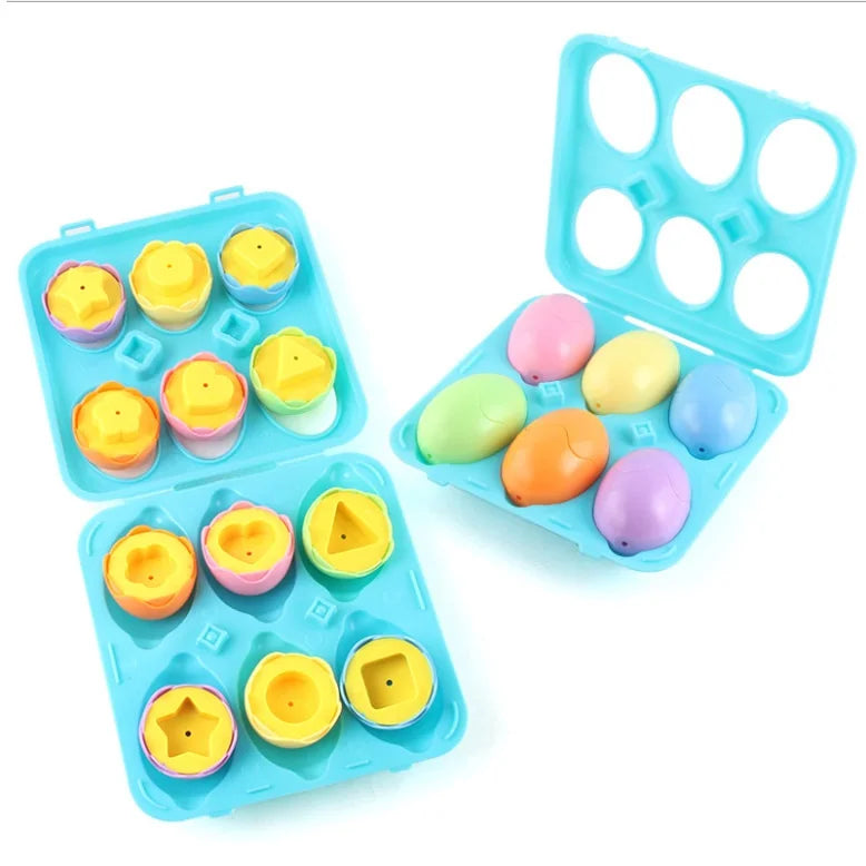 Colorful plastic ducks and eggs in a blue silicone mold on a white background