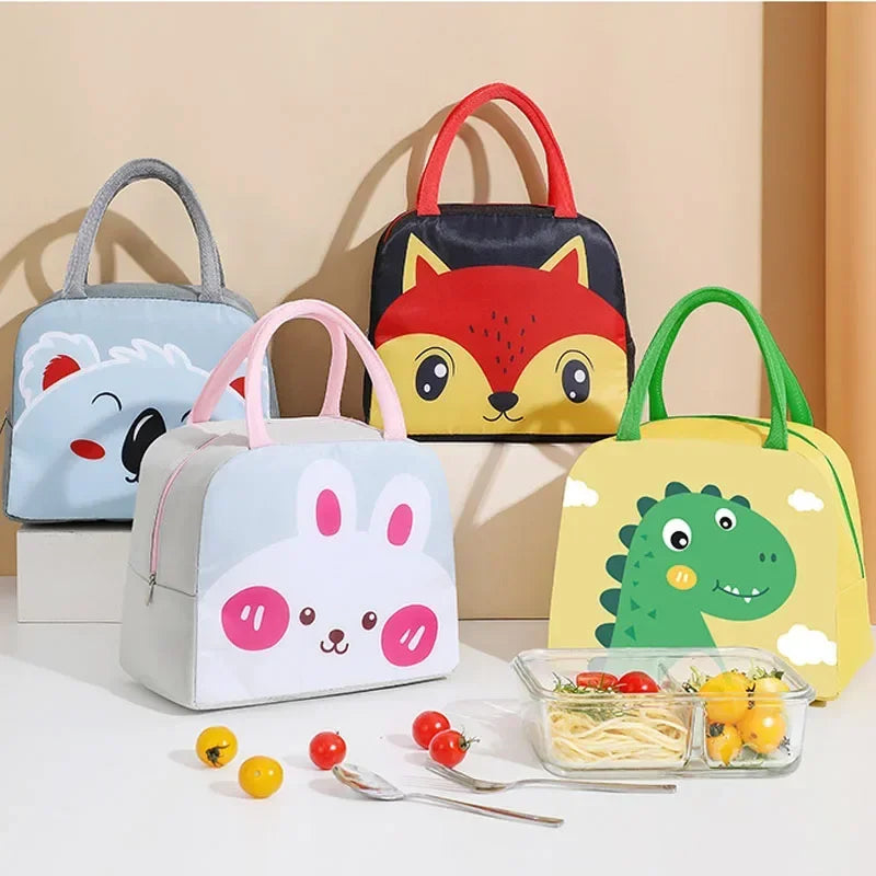 Set of cartoon-themed lunch bags with food items on a light background