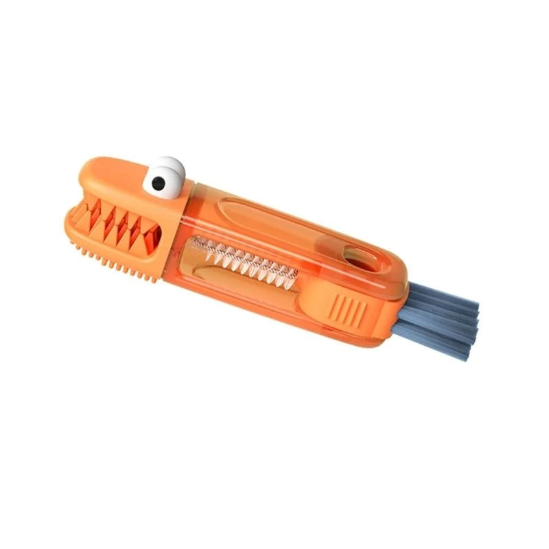 Orange car brush with a cartoonish design on a white background