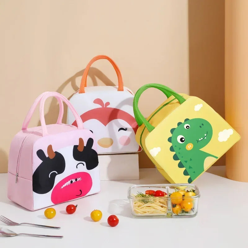 Cartoon animal thermal lunch bags in pink cow, yellow dinosaur, and white bird designs by Nestacular, waterproof and insulat