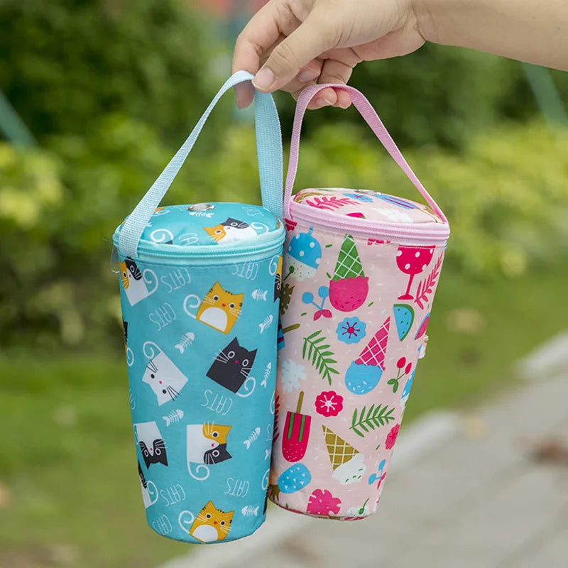Cartoon baby milk bottle insulation bags in blue with cats and pink with ice cream, portable and waterproof, by Nestacular.