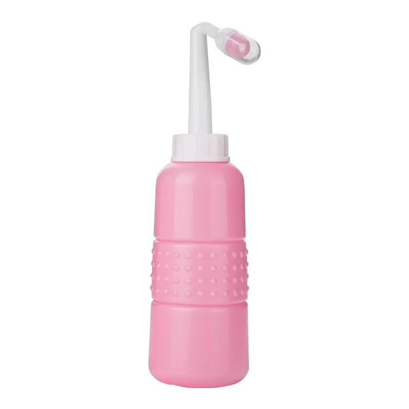 Pink nasal cleaning device with white nozzle on a white background