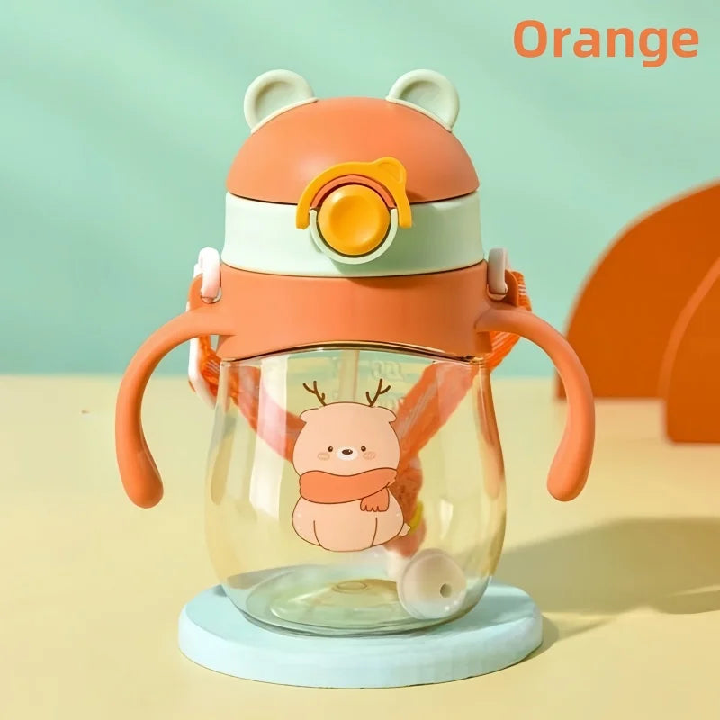 Children's cup with cartoon design on a light blue background