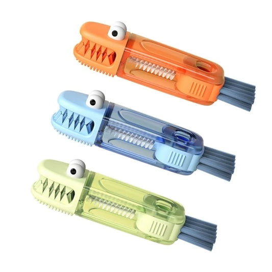 Colorful cartoon infant feeding bottle brushes in blue, orange, and green by Nestacular with cute eye design.