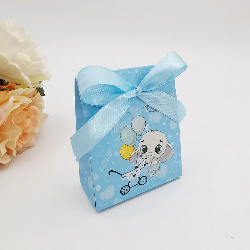 Blue gift box with a cartoon elephant and balloons on a white background