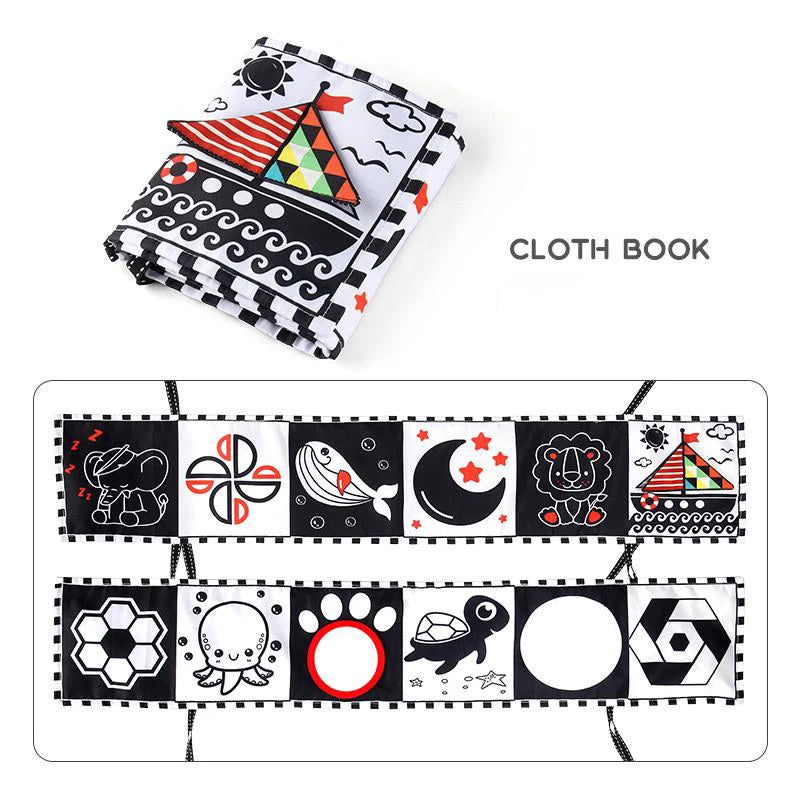 Black and white cloth book with colorful patterns on a white background