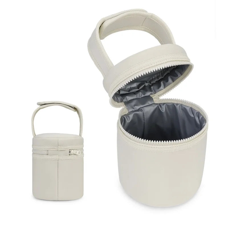 Beige travel case with a smaller matching container on a white background