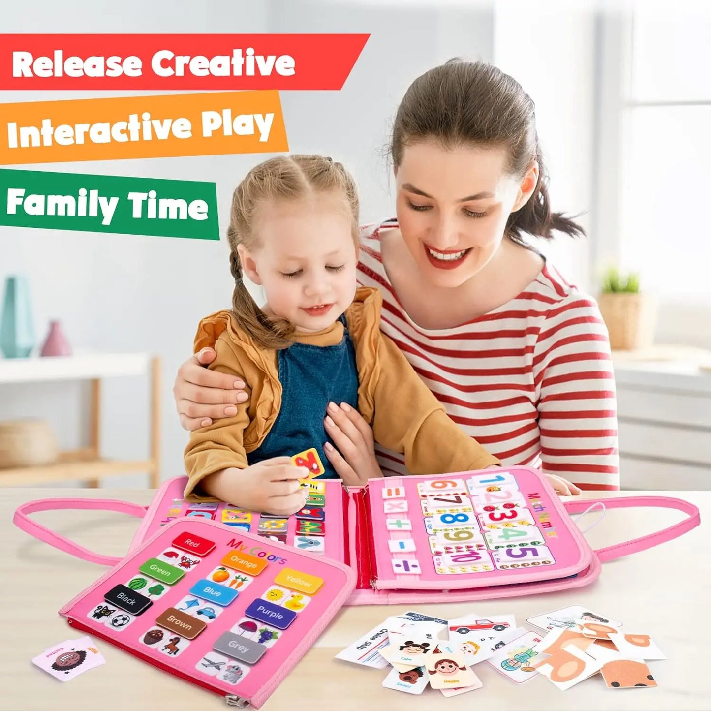 Woman and child playing with a pink educational toy book in a home setting.