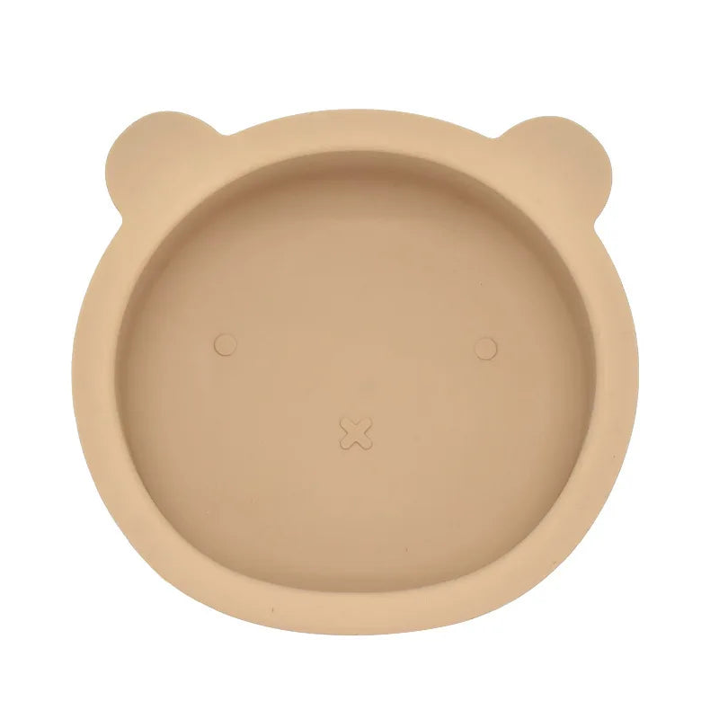 Beige bowl with bear ears on a white background