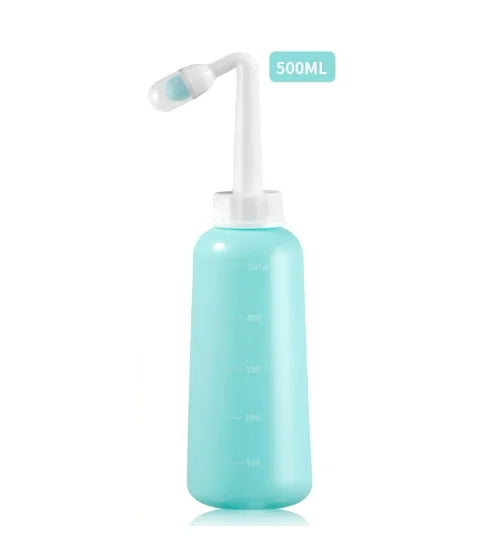 Turquoise nasal irrigation device with white nozzle on a white background