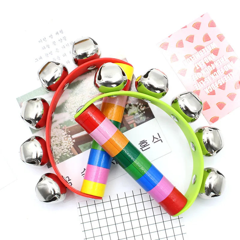 Colorful children's tambourine with metal jingles on a white background
