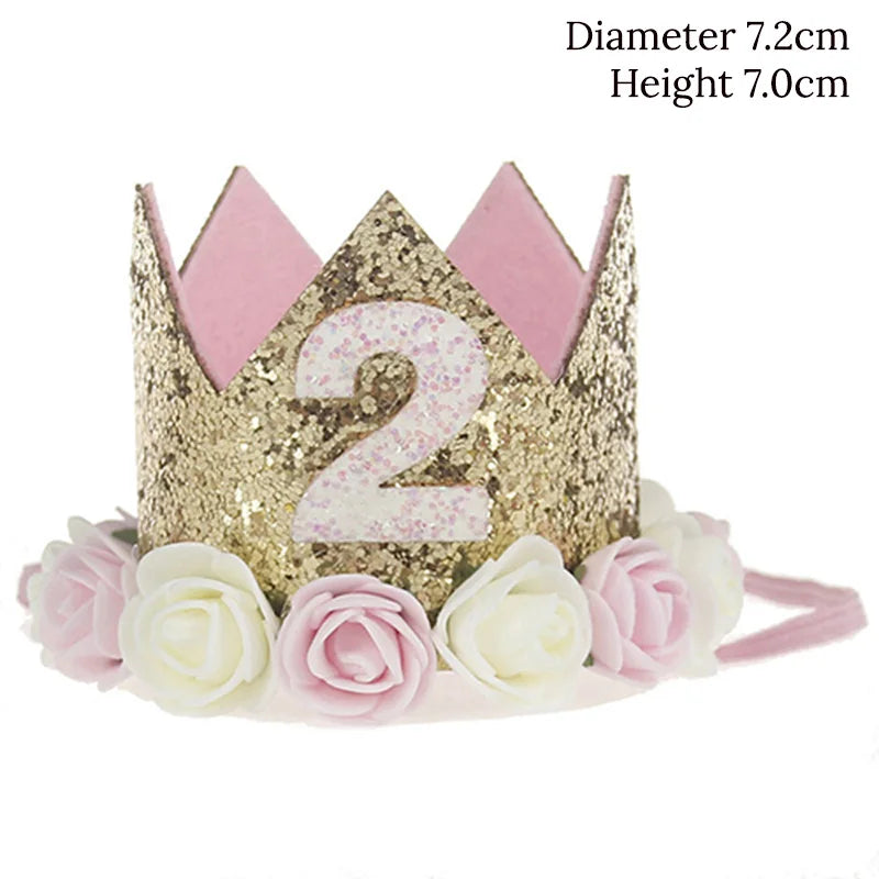 Gold and pink tiara with number '2' and flowers on a white background