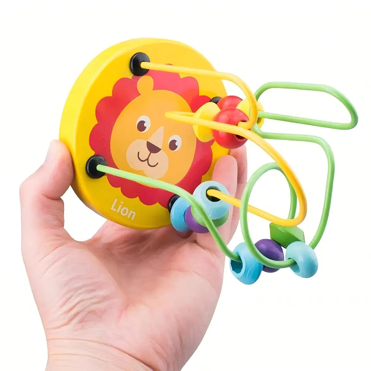 Colorful lion-themed baby toy held in a hand against a white background