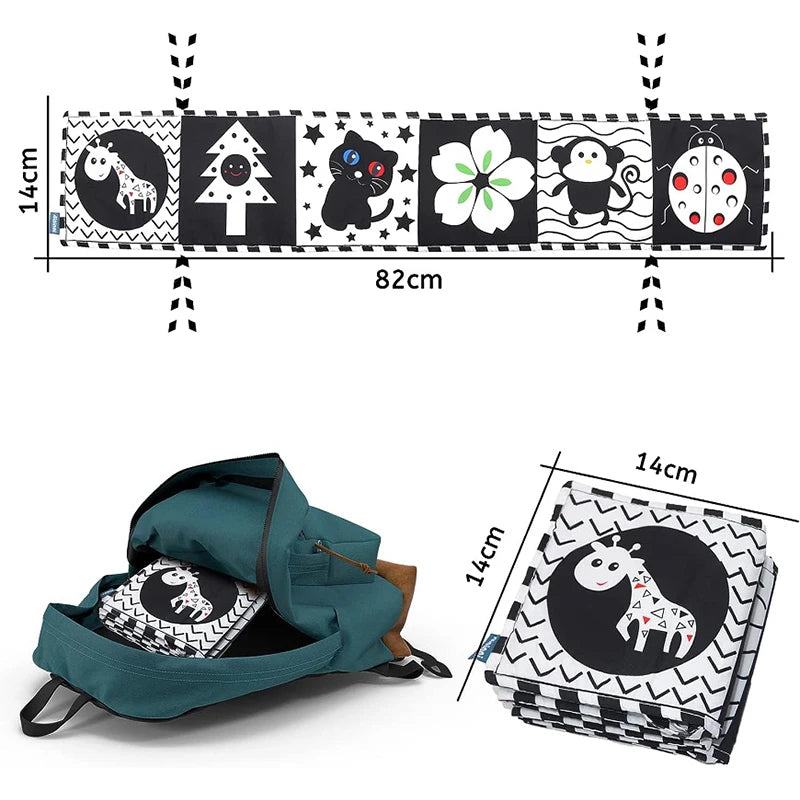 Teal bag with black and white patterned items, including a rug with animal illustrations, on a white background.