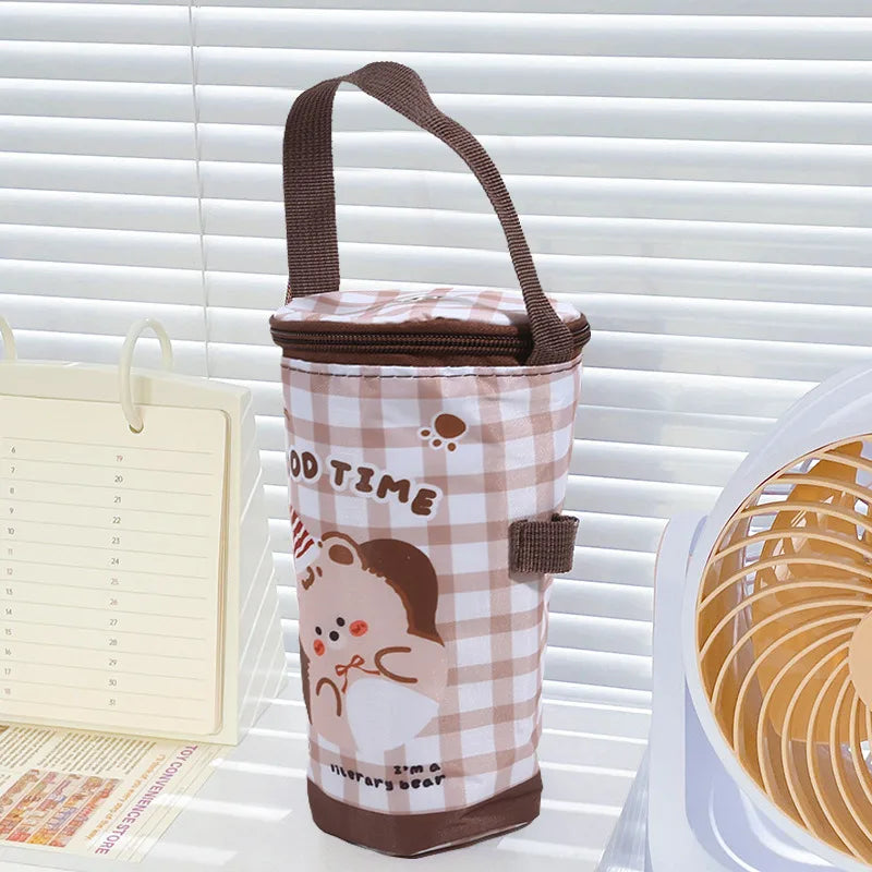 Plaid insulated bottle bag with cartoon design on a white surface