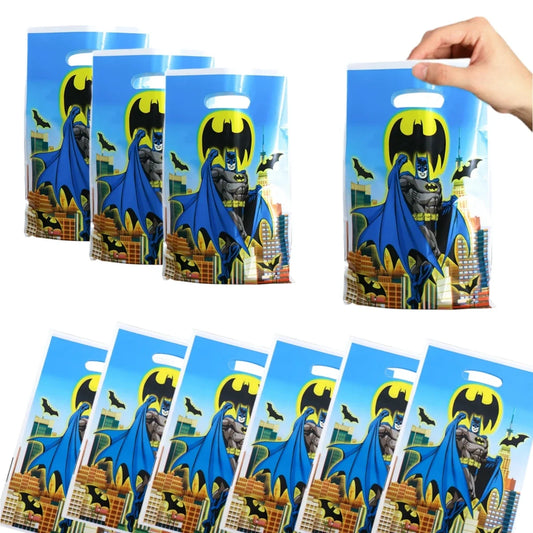 Batman-themed goodie bags with a hand holding one bag.